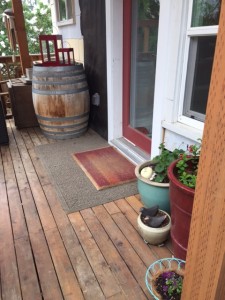 After - Back Door (close-up) Removed the "to-do" bags and added flower pots. Goodbye to so much chaos.