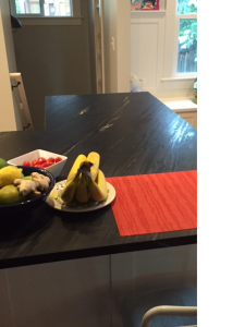 After - Kitchen Counter A placemat keeps the space clear for eating or working at the counter.